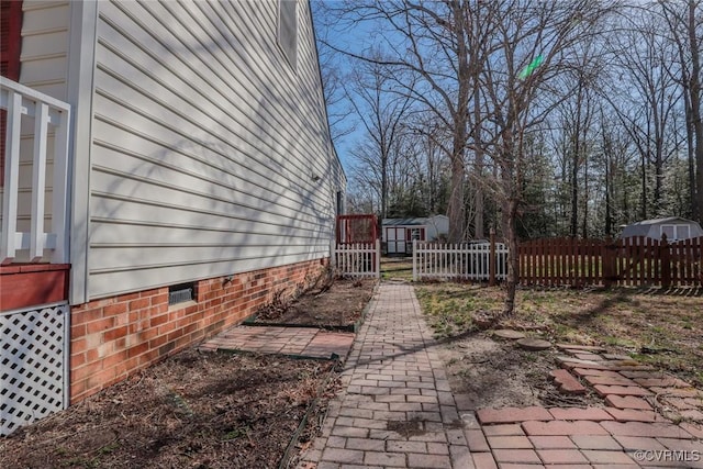 view of property exterior featuring crawl space and fence