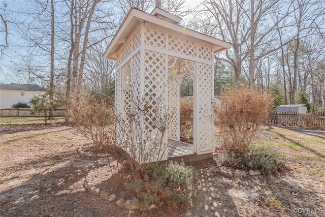 view of outdoor structure featuring fence