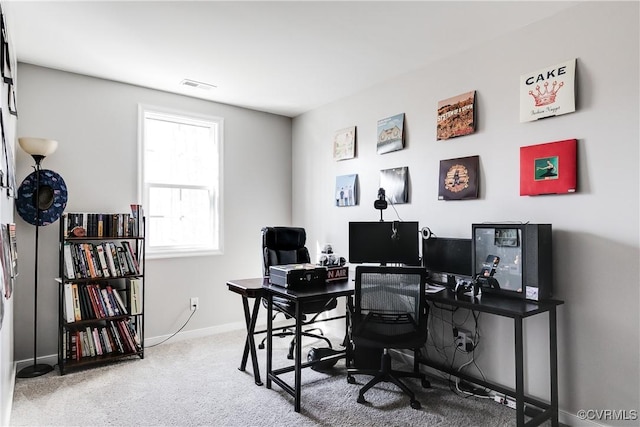 carpeted home office with baseboards and visible vents