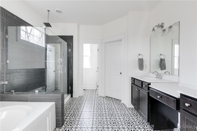 full bathroom with a shower stall, a washtub, and vanity