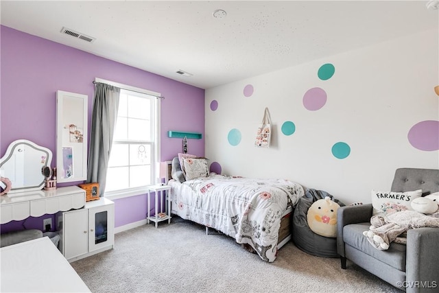 bedroom featuring light carpet and visible vents