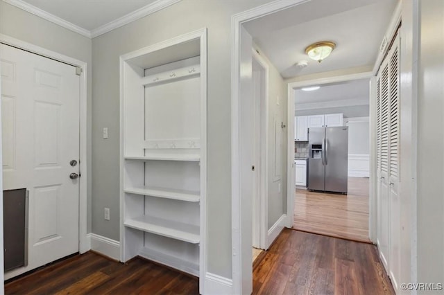 hall with baseboards, dark wood-style floors, and crown molding