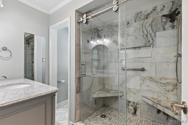 full bathroom with vanity, ornamental molding, and a shower stall