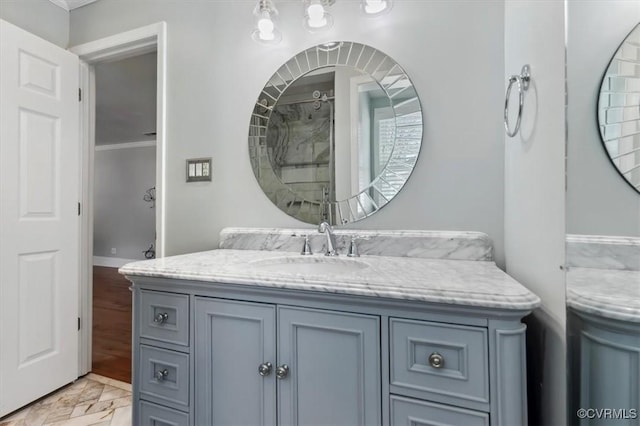 full bath with ornamental molding and vanity