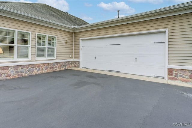 garage featuring driveway