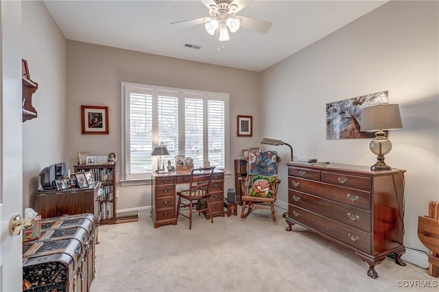 home office with visible vents, carpet floors, baseboards, and ceiling fan