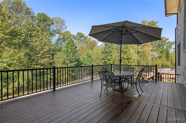 deck with outdoor dining space