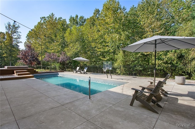 view of pool with a fenced in pool, a patio, and fence