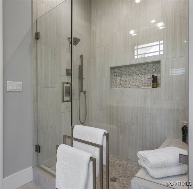 bathroom with tiled shower