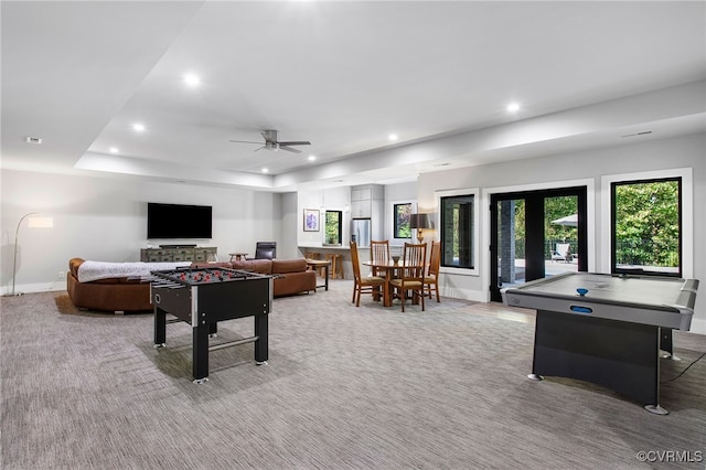 recreation room with ceiling fan, recessed lighting, baseboards, and light carpet