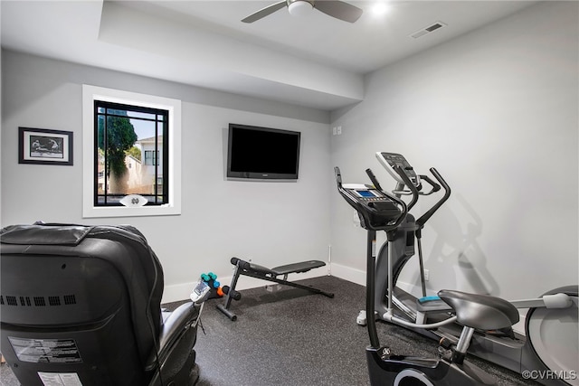 workout area featuring visible vents, ceiling fan, and baseboards