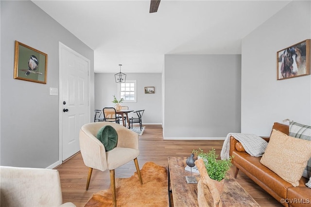 living room featuring baseboards and wood finished floors