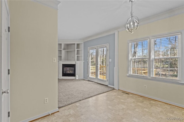 unfurnished living room featuring carpet, baseboards, visible vents, a glass covered fireplace, and crown molding