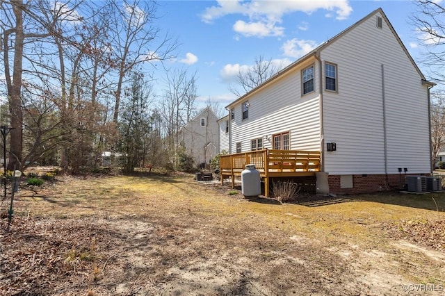 back of house featuring crawl space, central AC unit, and a deck