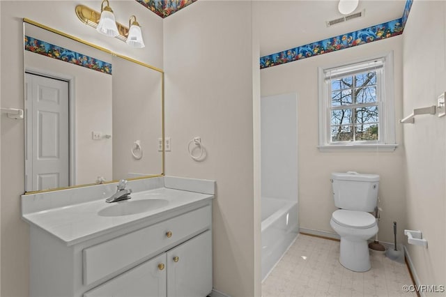 bathroom featuring visible vents, baseboards, toilet, and vanity