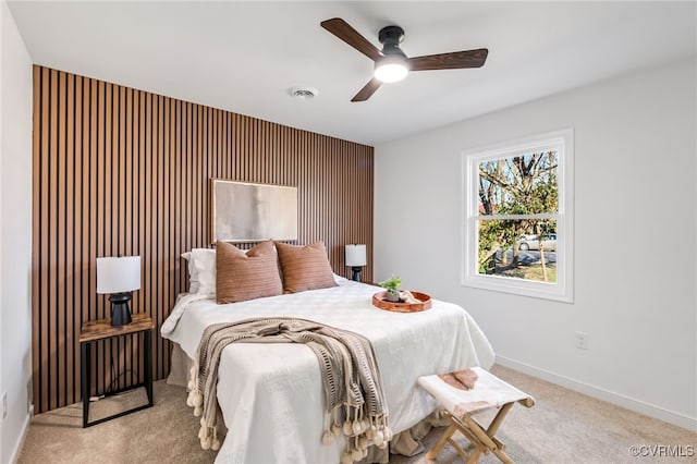 bedroom with visible vents, carpet flooring, a ceiling fan, and baseboards