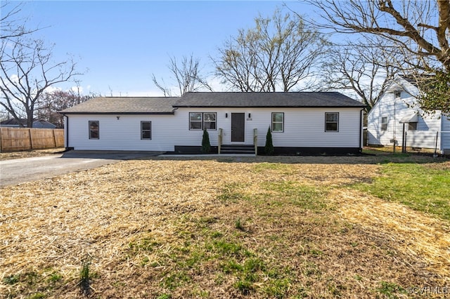 single story home featuring a front yard and fence