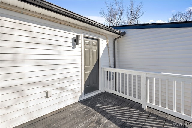 doorway to property featuring a wooden deck