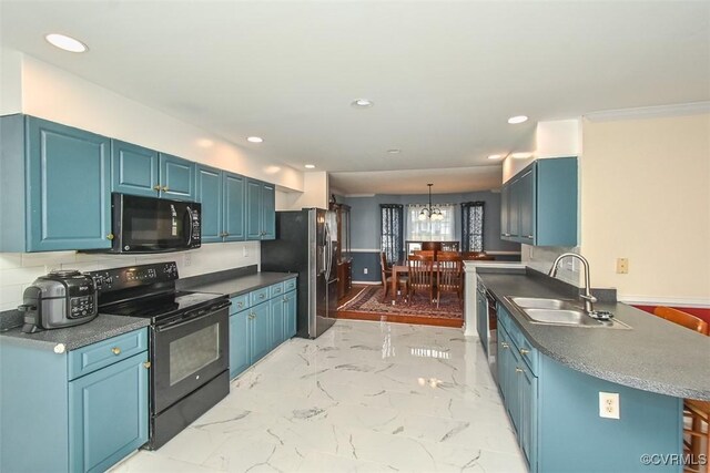 kitchen featuring an inviting chandelier, recessed lighting, blue cabinets, a sink, and black appliances