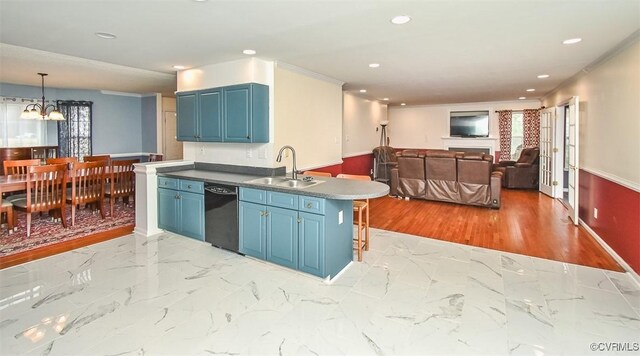 kitchen with a sink, dishwasher, blue cabinetry, a peninsula, and recessed lighting