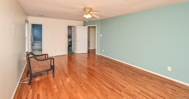 unfurnished bedroom with baseboards and wood finished floors