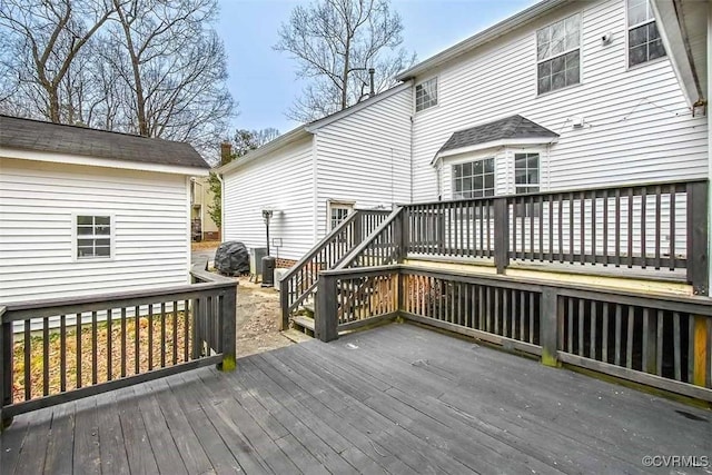 wooden terrace featuring central AC unit