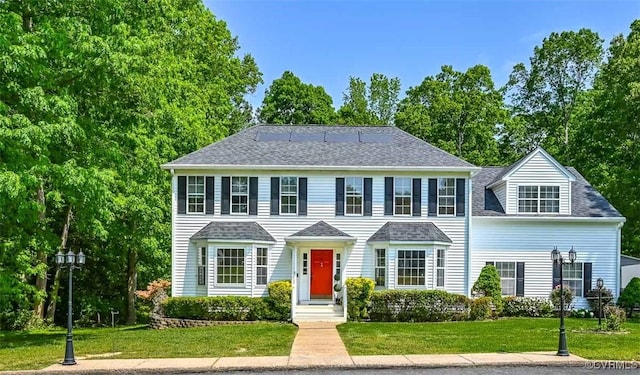 3090 Magnolia Woods Ct, Quinton, VA 23141 - colonial inspired home with a shingled roof and a front lawn