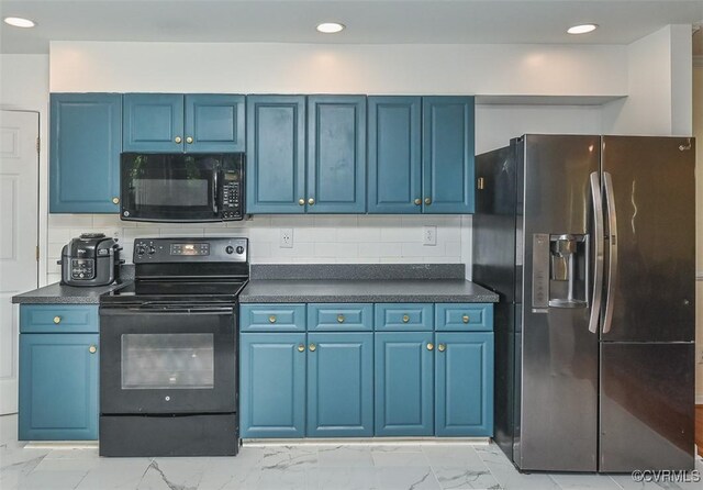 3090 Magnolia Woods Ct, Quinton, VA 23141 - kitchen with blue cabinets, marble finish floor, black appliances, and dark countertops
