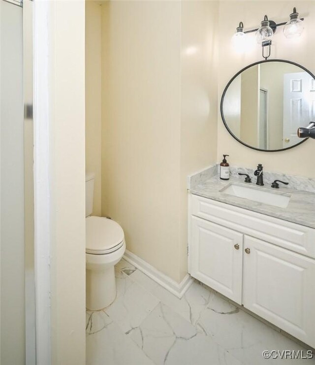 3090 Magnolia Woods Ct, Quinton, VA 23141 - bathroom featuring toilet, baseboards, marble finish floor, and vanity