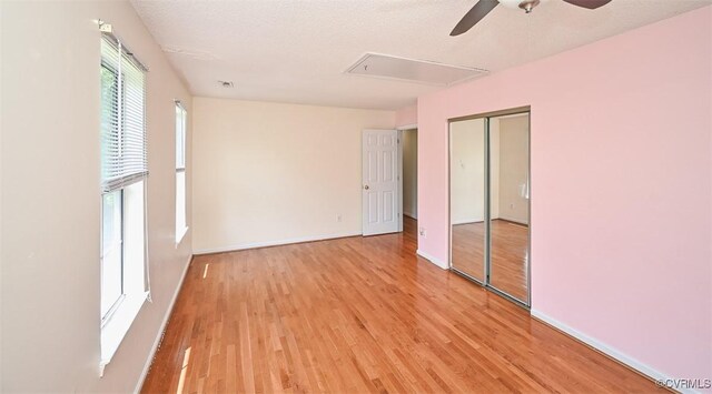 3090 Magnolia Woods Ct, Quinton, VA 23141 - unfurnished bedroom featuring ceiling fan, attic access, light wood-type flooring, baseboards, and a closet