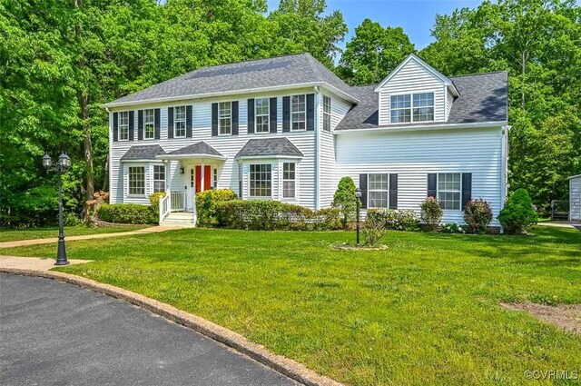3090 Magnolia Woods Ct, Quinton, VA 23141 - colonial house featuring a front yard