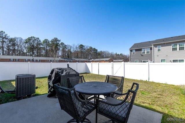 view of patio with outdoor dining area, cooling unit, a fenced backyard, and grilling area