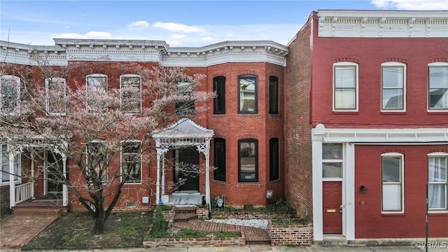 view of property featuring brick siding