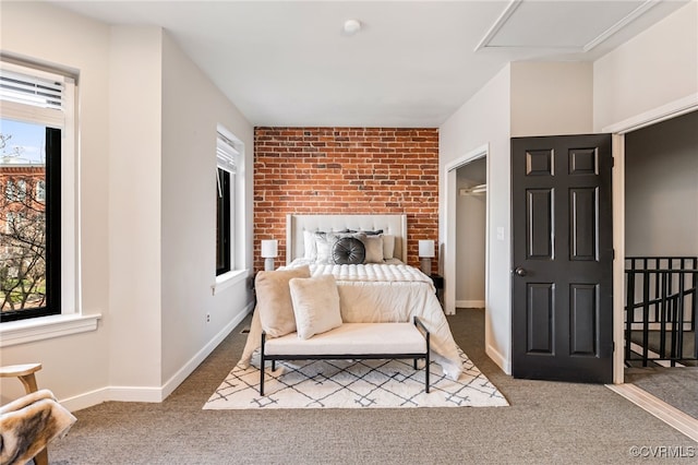 bedroom featuring baseboards and carpet