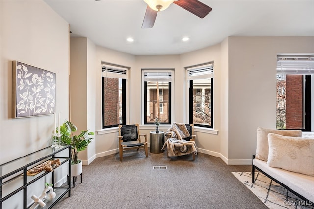 living area featuring recessed lighting, visible vents, carpet floors, and baseboards