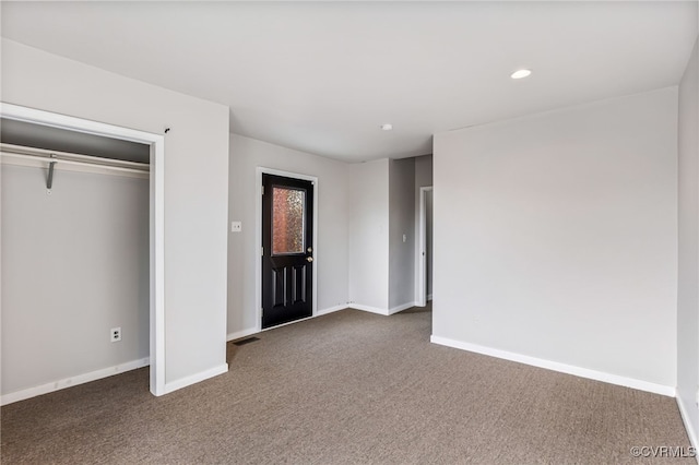 unfurnished bedroom featuring recessed lighting, visible vents, baseboards, and dark carpet