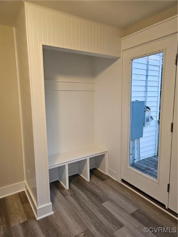 mudroom with wood finished floors and baseboards