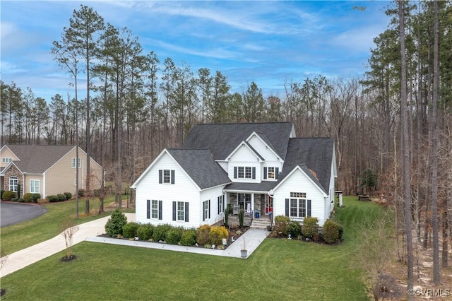 traditional-style house with a front lawn and a shingled roof