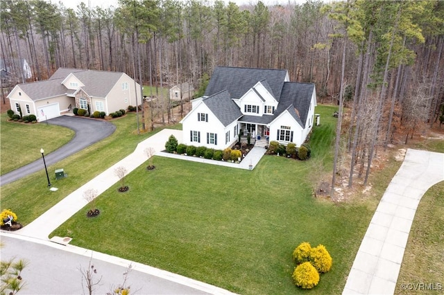 bird's eye view featuring a wooded view