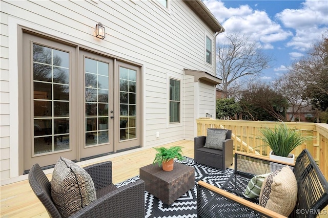 wooden terrace featuring an outdoor hangout area