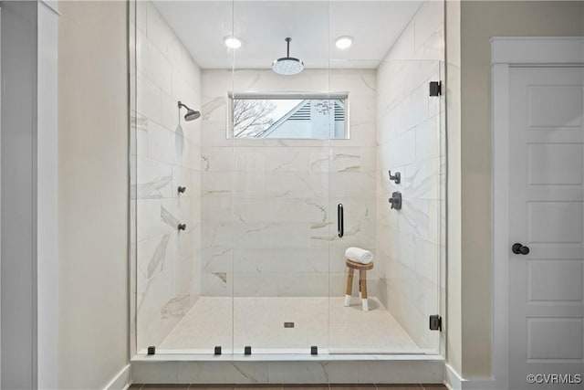 full bathroom featuring a shower stall