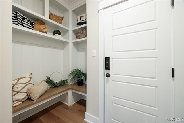 mudroom with baseboards and wood finished floors