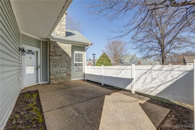 view of patio with fence