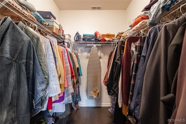 walk in closet with visible vents and wood finished floors