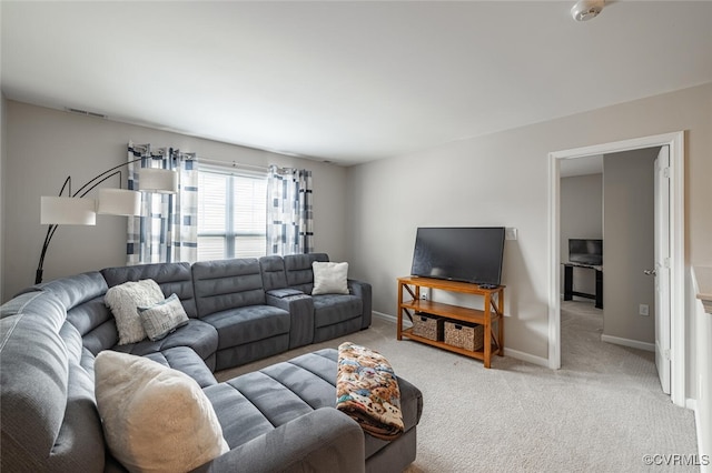 living room featuring visible vents, baseboards, and light carpet