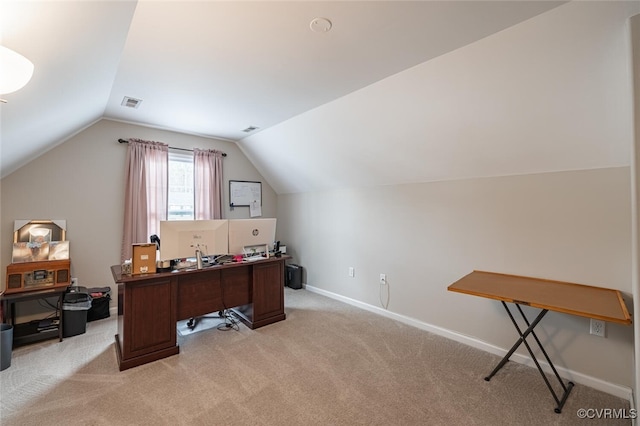 home office featuring visible vents, lofted ceiling, light colored carpet, and baseboards