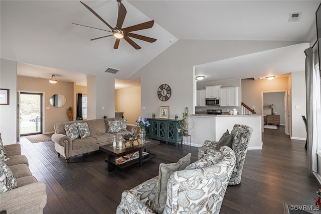 living room featuring a ceiling fan, baseboards, visible vents, high vaulted ceiling, and dark wood finished floors