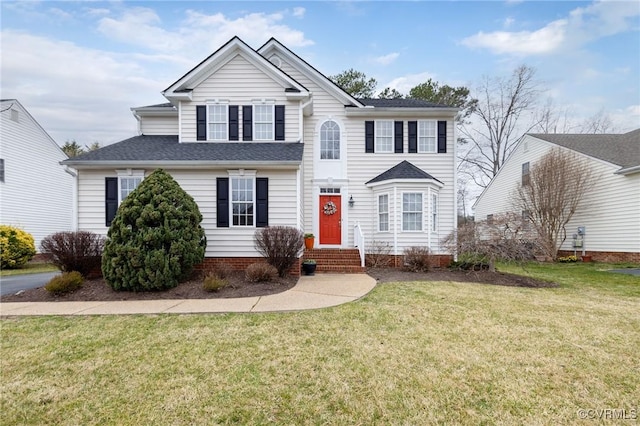 traditional home with a front yard and entry steps