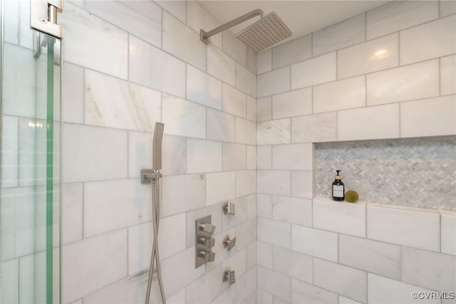 bathroom with tiled shower