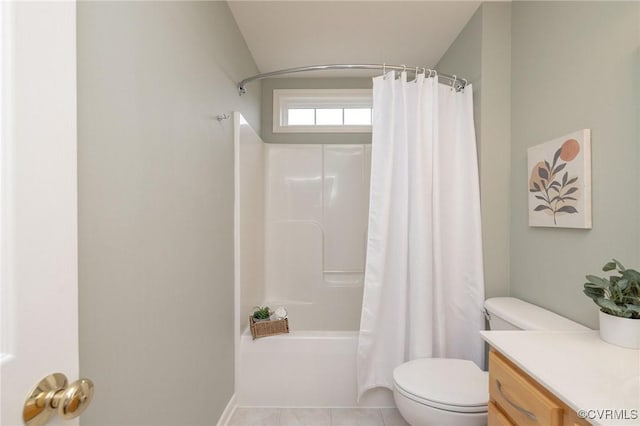 bathroom featuring tile patterned floors, toilet, shower / bath combo, and vanity